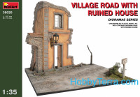 Village road with ruined house