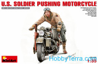 U.S. Soldier pushing motorcycle