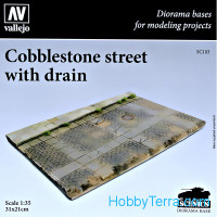 Cobblestone street with a drain